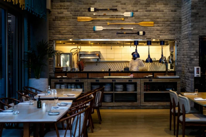 Functional and stylish commercial interiors for restaurants and hotels Commercial interior design for restaurant and hospitality space with warm lighting and wooden finishes